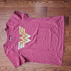 A women's t shirt with Wonder women logo size XL.